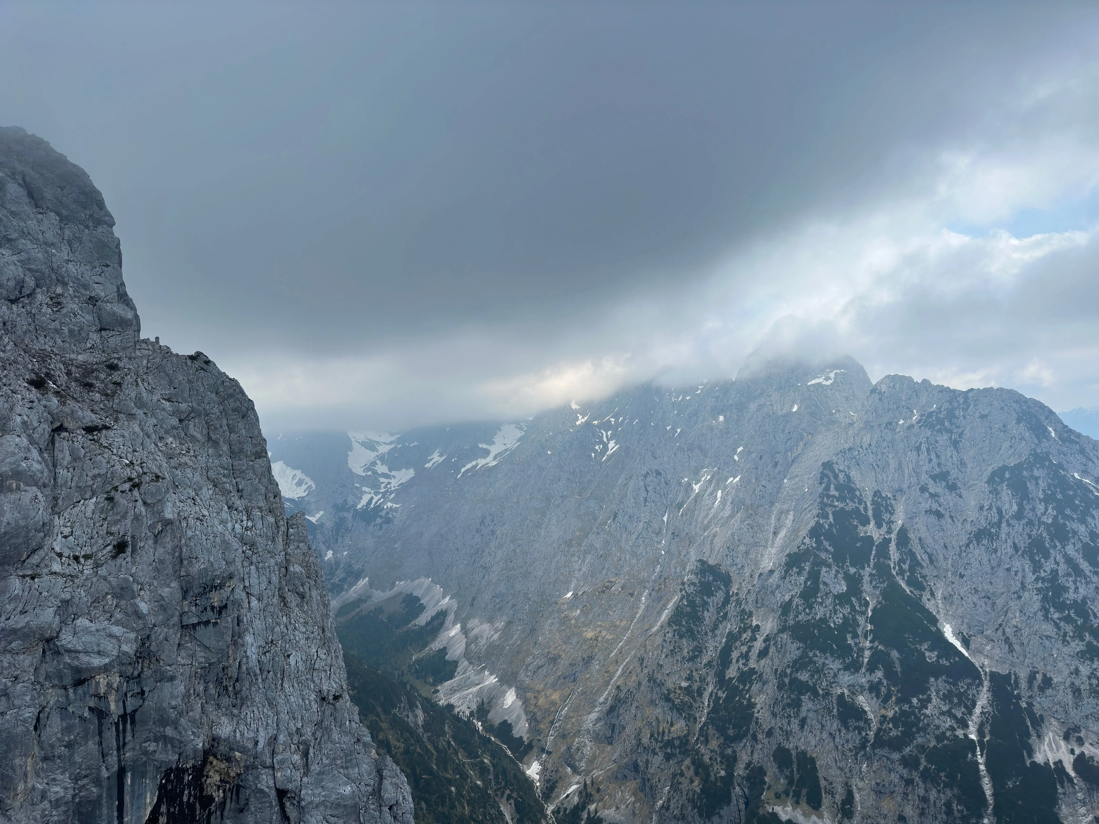 Alpine mountain ridge under heavy cloud cover