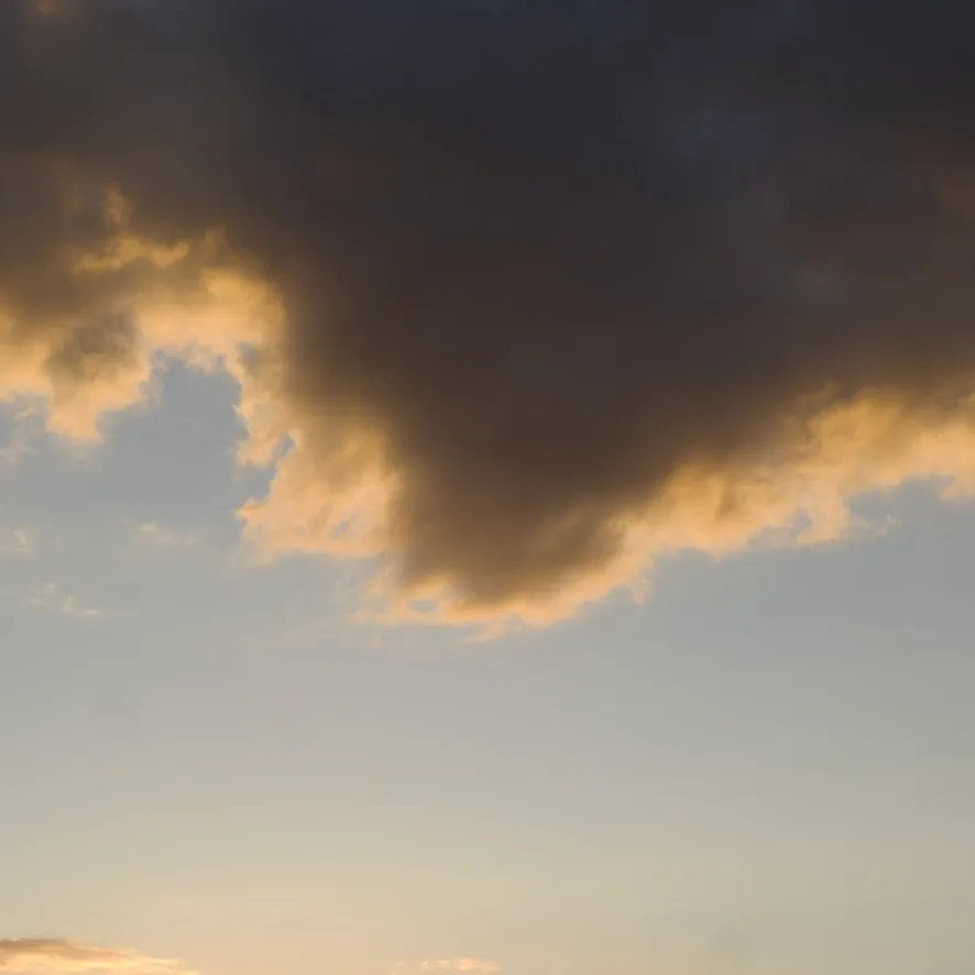 Dark cloud with golden edges at sunset